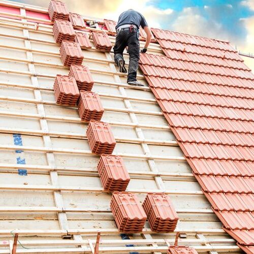 Roofer Installs Tile Roofing