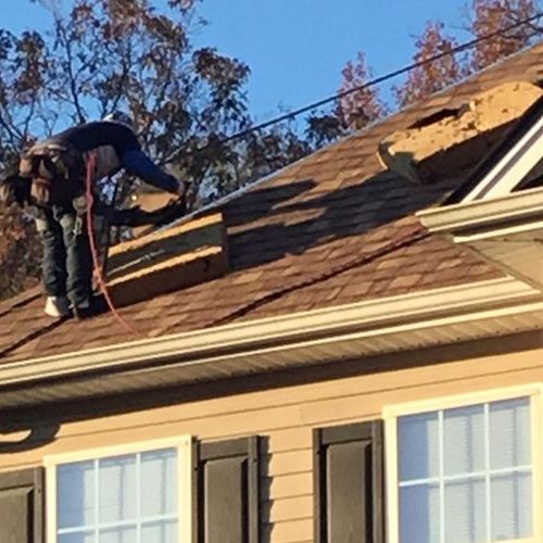 Roofer Works on Residential Roof Repair